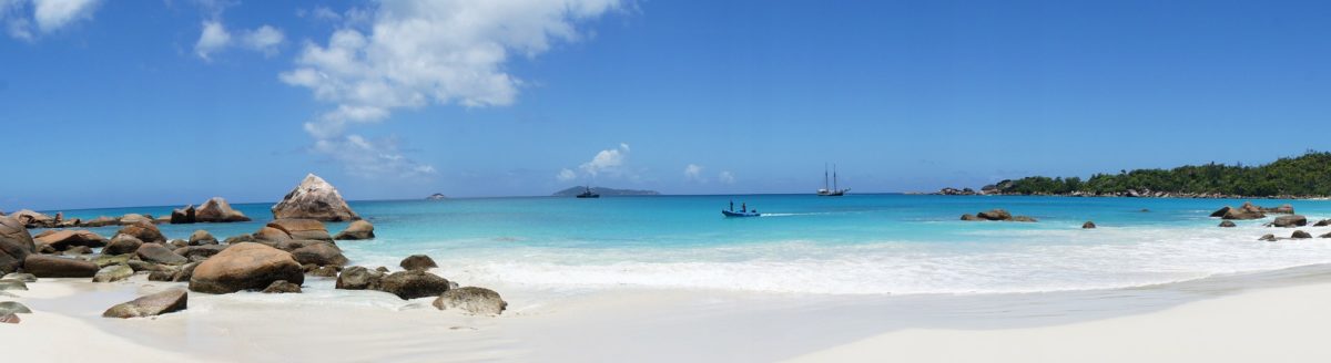 White sand beach with yachts.