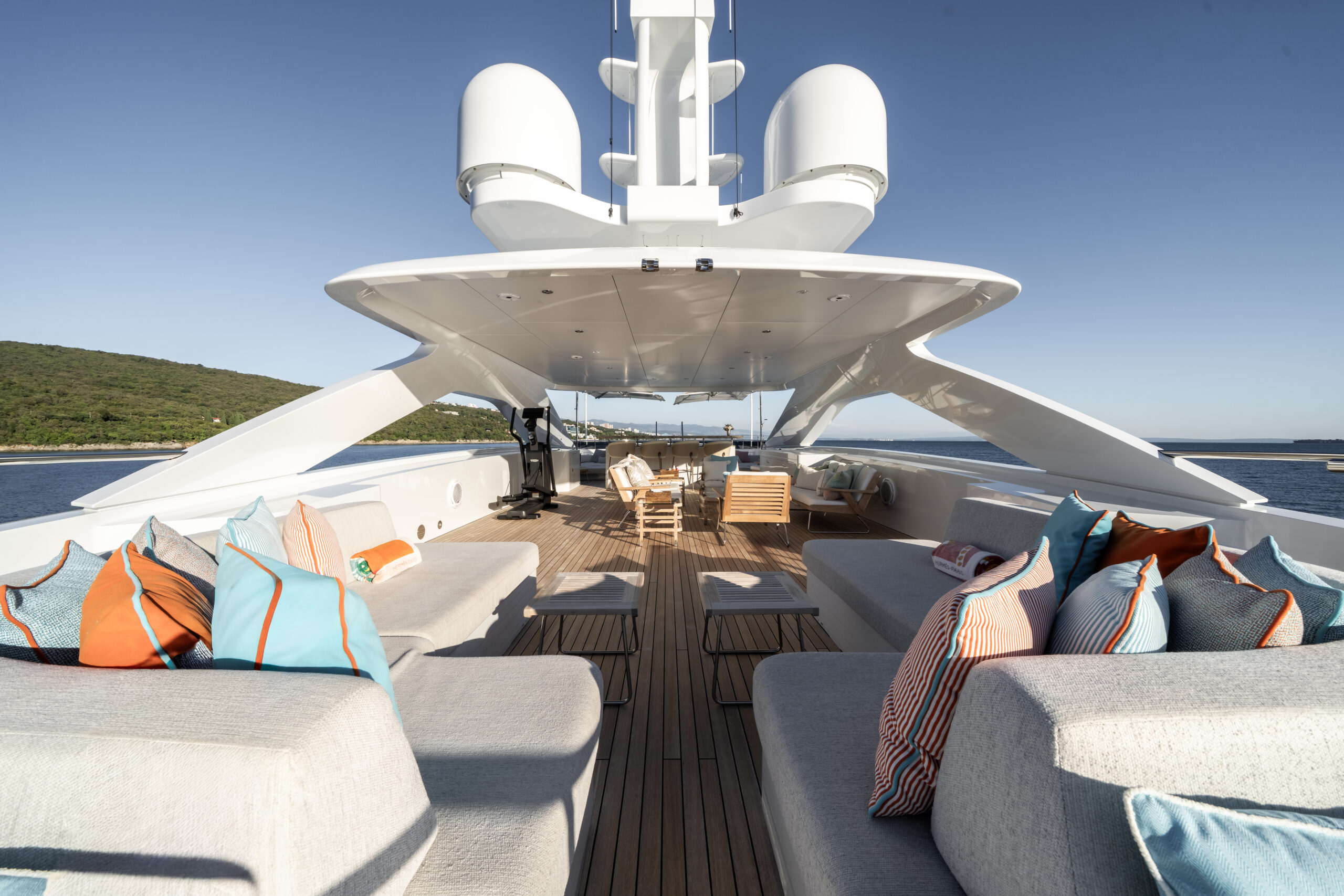 Expansive sundeck with a fully equipped bar, lounge areas and jacuzzi with sun pads