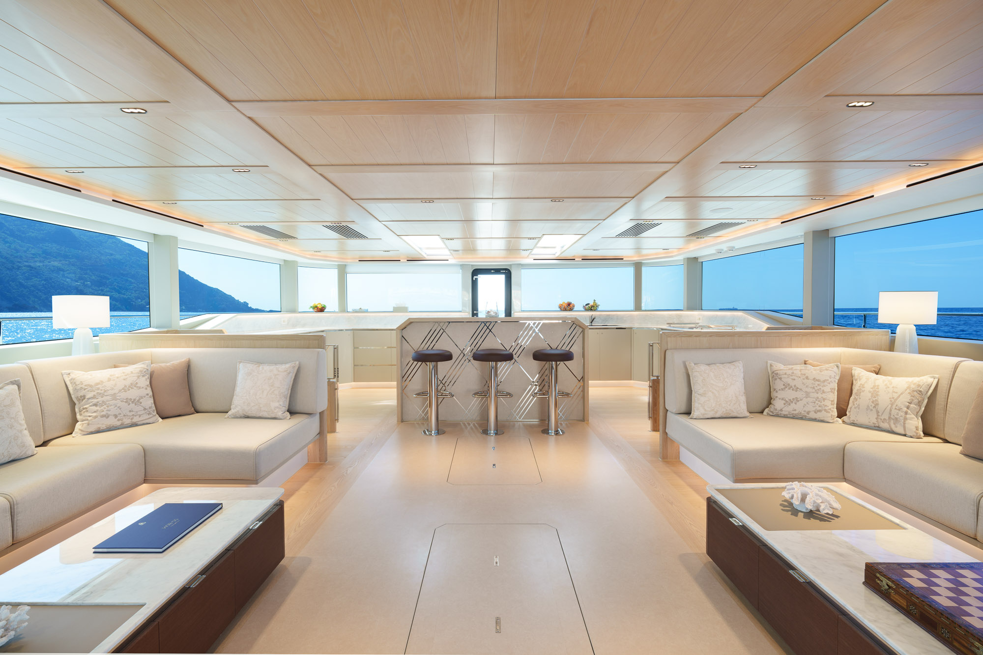 Panoramic windows flooding the saloon with abundant natural light